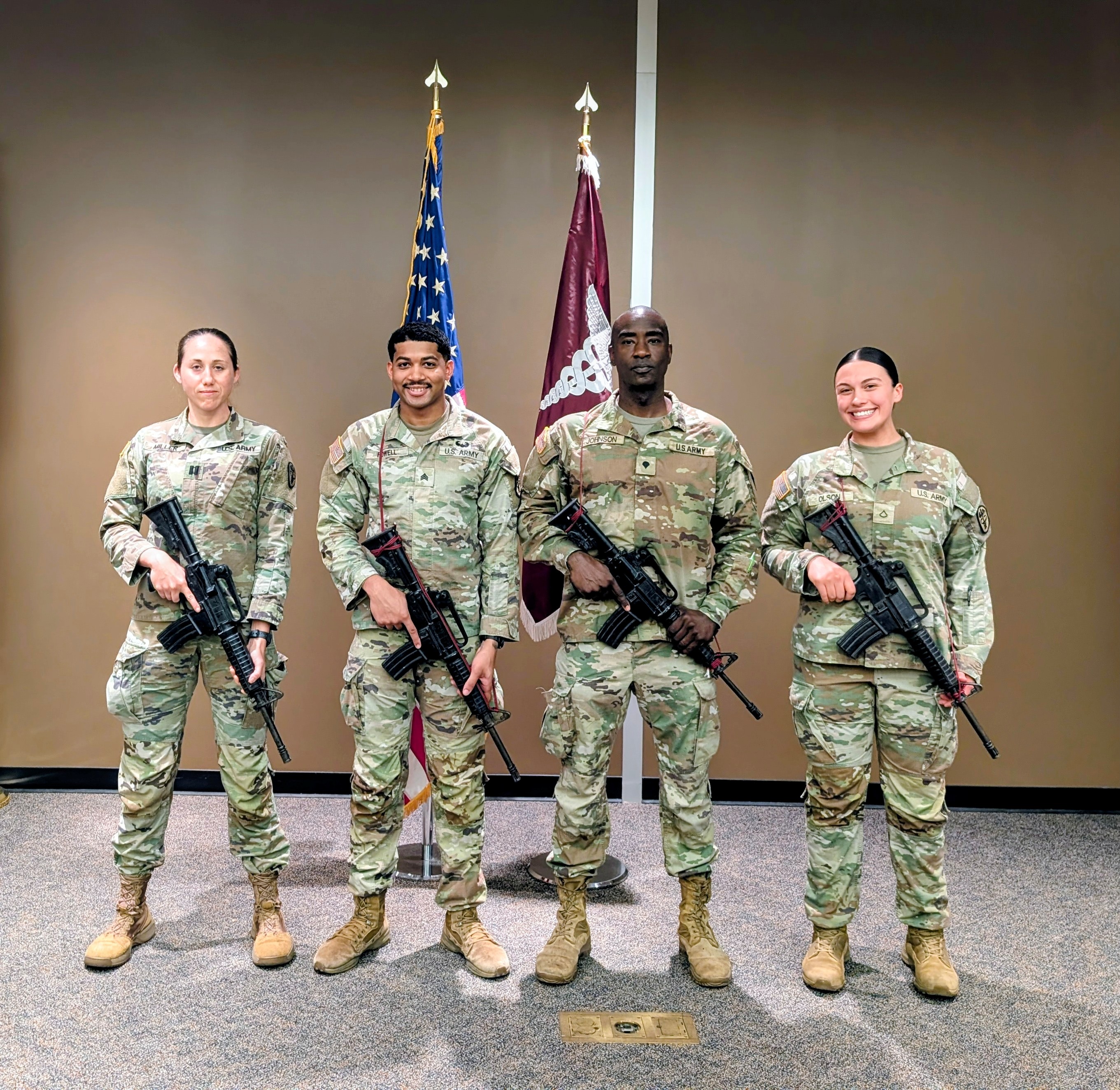 Competitors from PHC, East: From left to right: CPT Miller, SGT Poell, SPC Johnson, PFC Olson Photo Credit: 1SG Montenegro Competitors from PHC, East: From left to right: CPT Miller, SGT Poell, SPC Johnson, PFC Olson Photo Credit: 1SG Montenegro